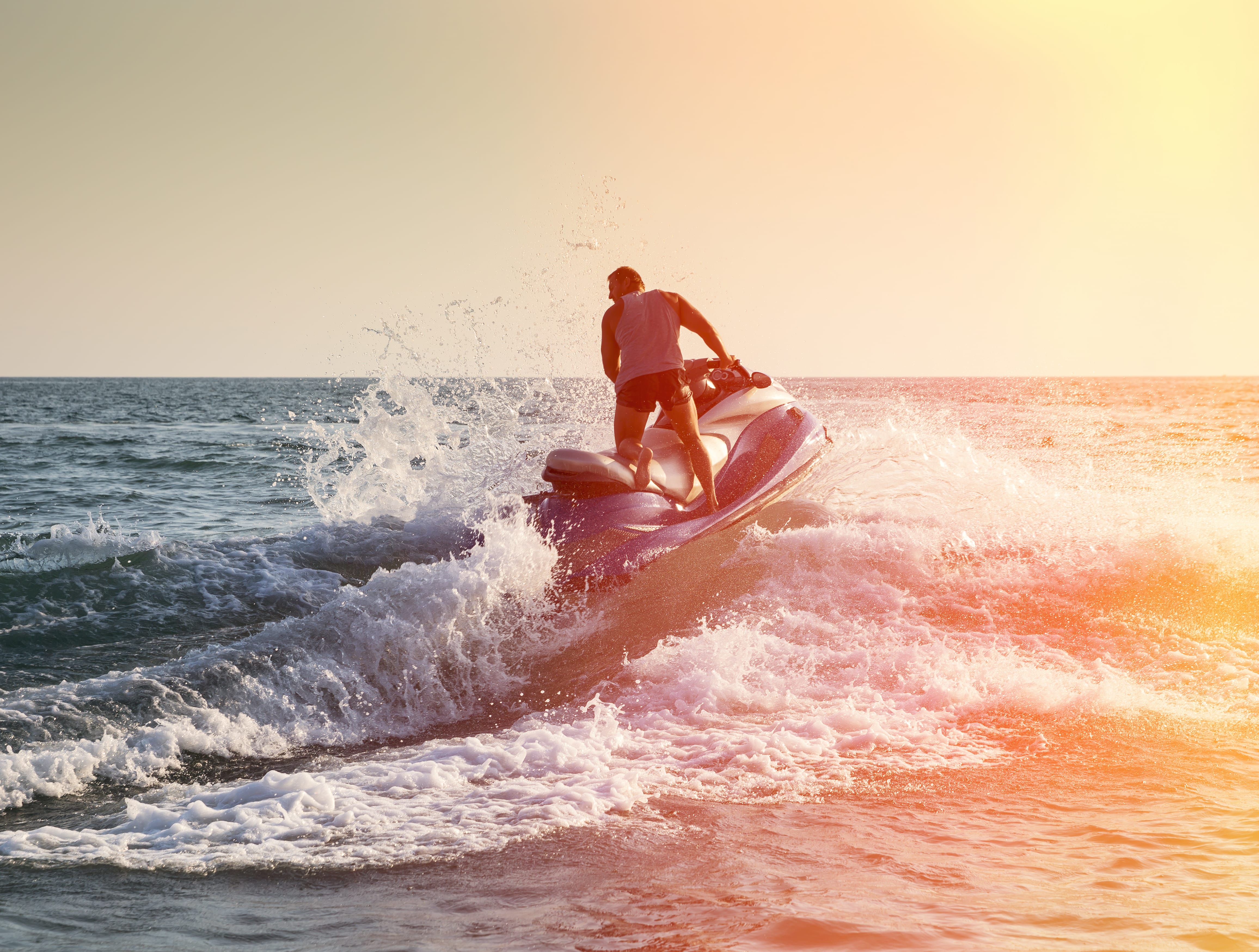 a man riding a surfboard