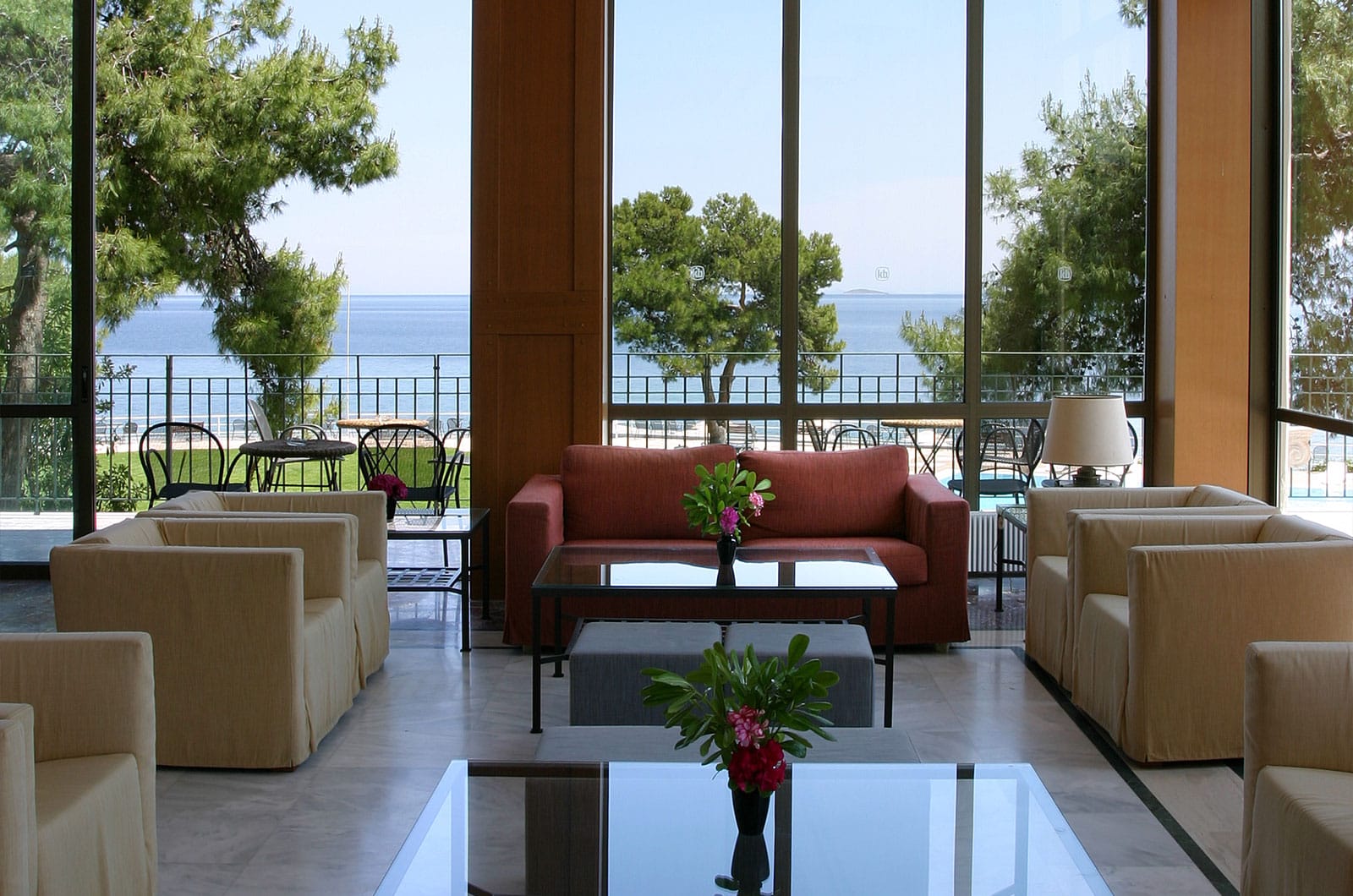a living room with a view of the ocean