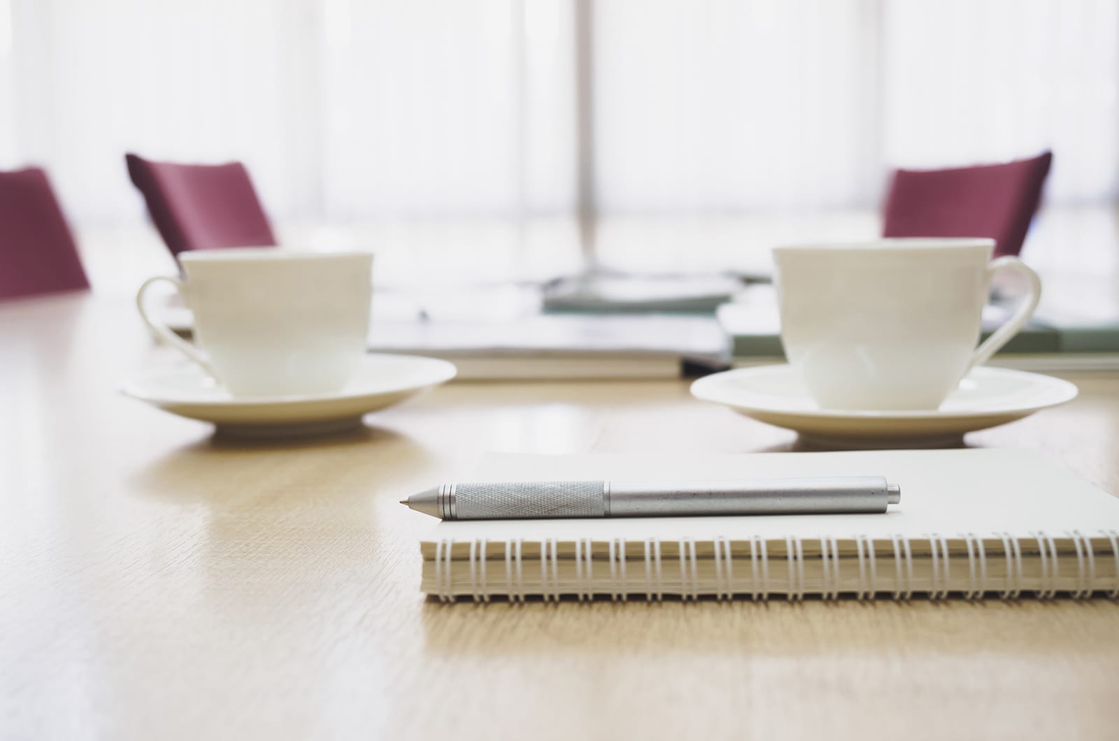 a set of white plates and a knife on a table