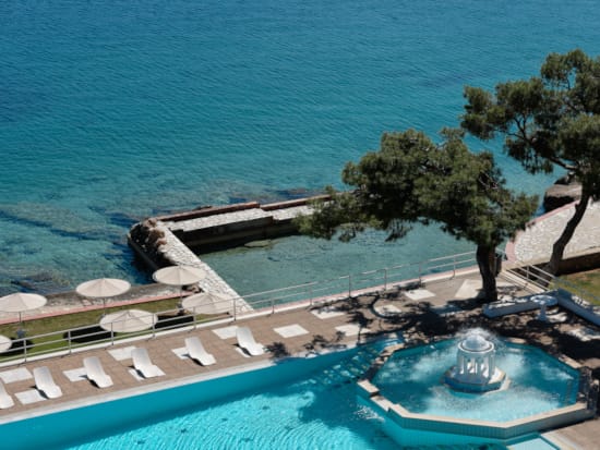 a pool with a building in the background