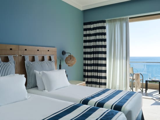 a bed with a striped blanket