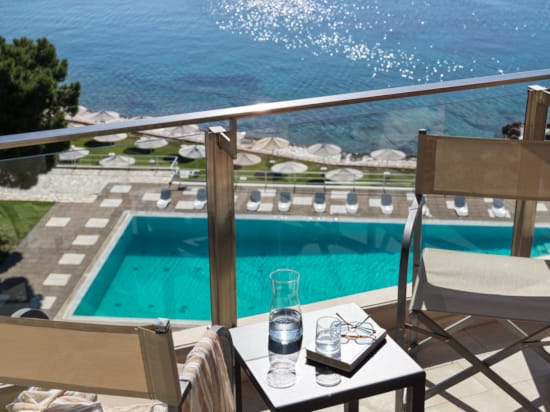 a pool with chairs around it