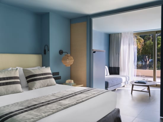 a bedroom with a bed and a chair