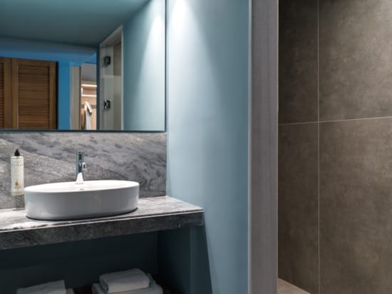 a bathroom with a sink and mirror