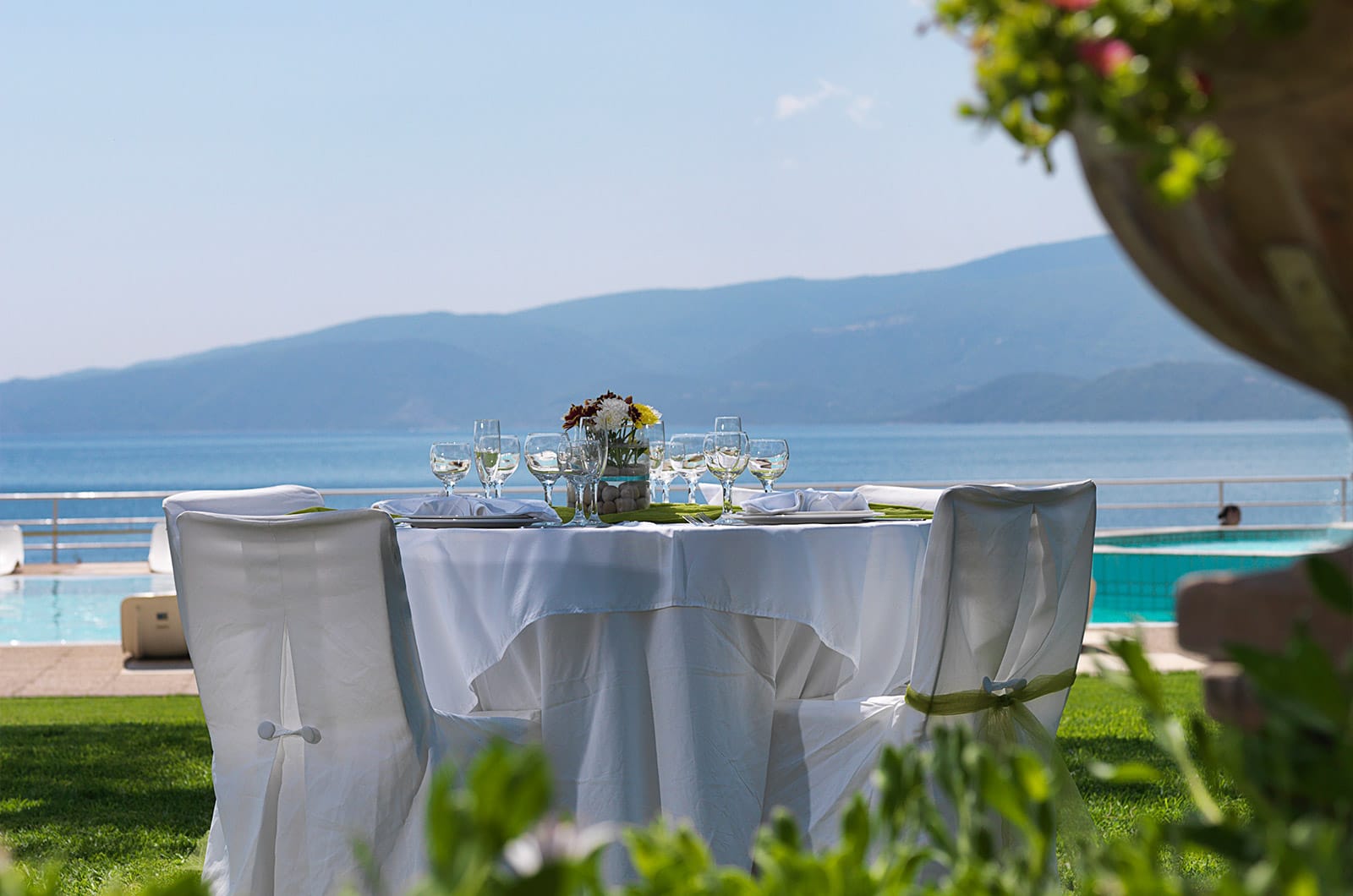 a table and chairs on a lawn
