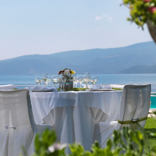 a table and chairs on a lawn