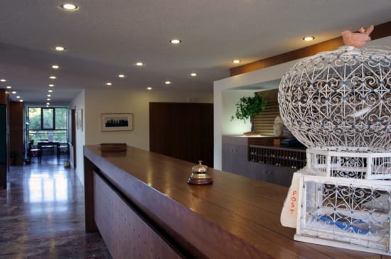 a large room with a large chandelier and a large table