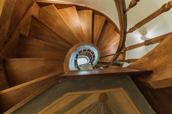 a wooden ceiling with a fan