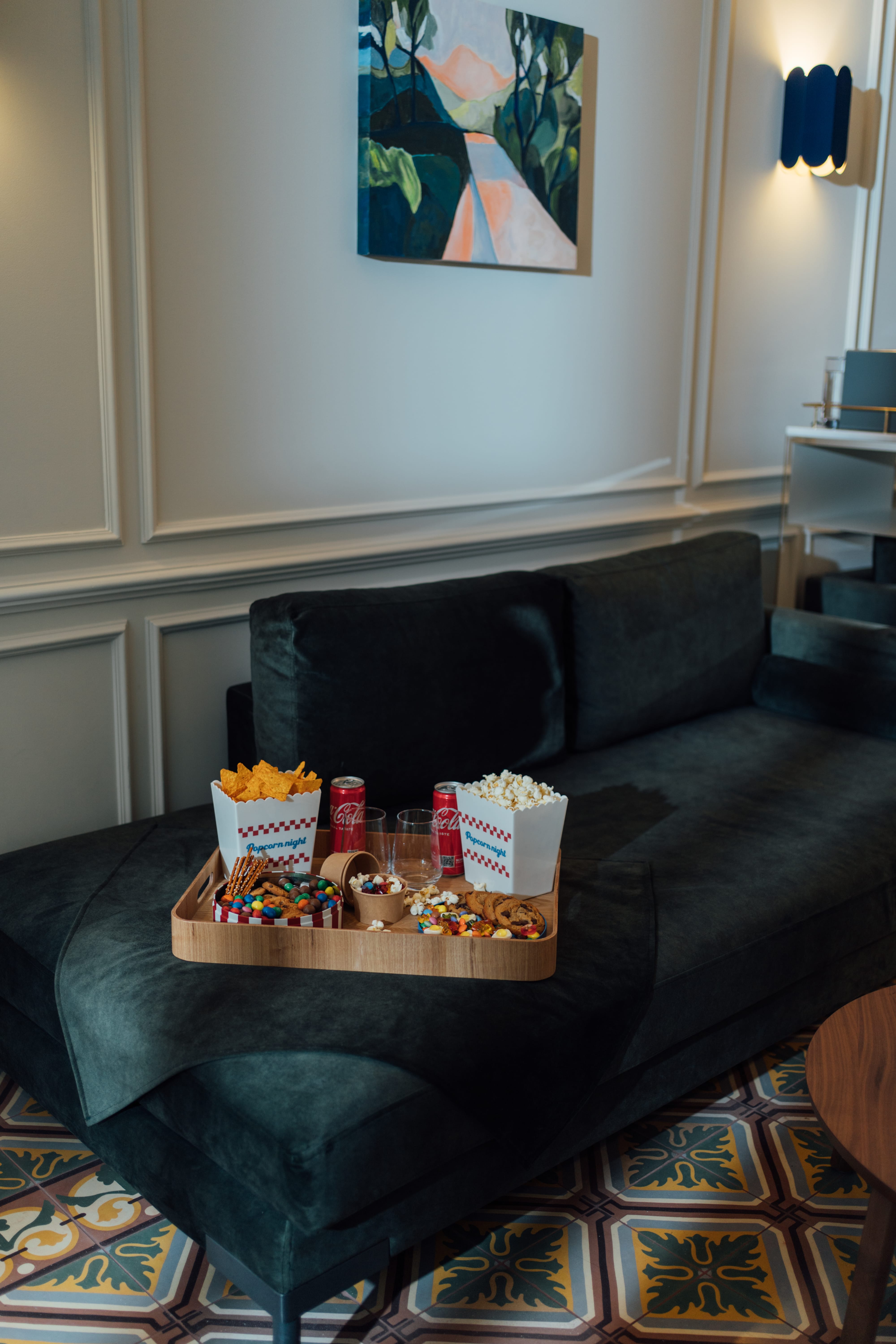 a couch with a table and food on it