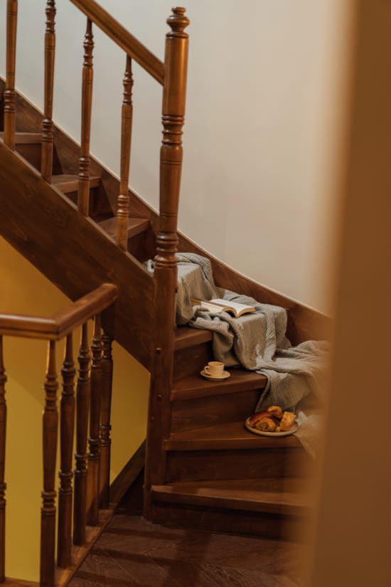 a staircase with a pillow and food on it
