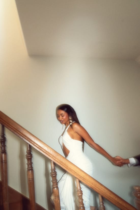 a person in a wedding dress on a staircase