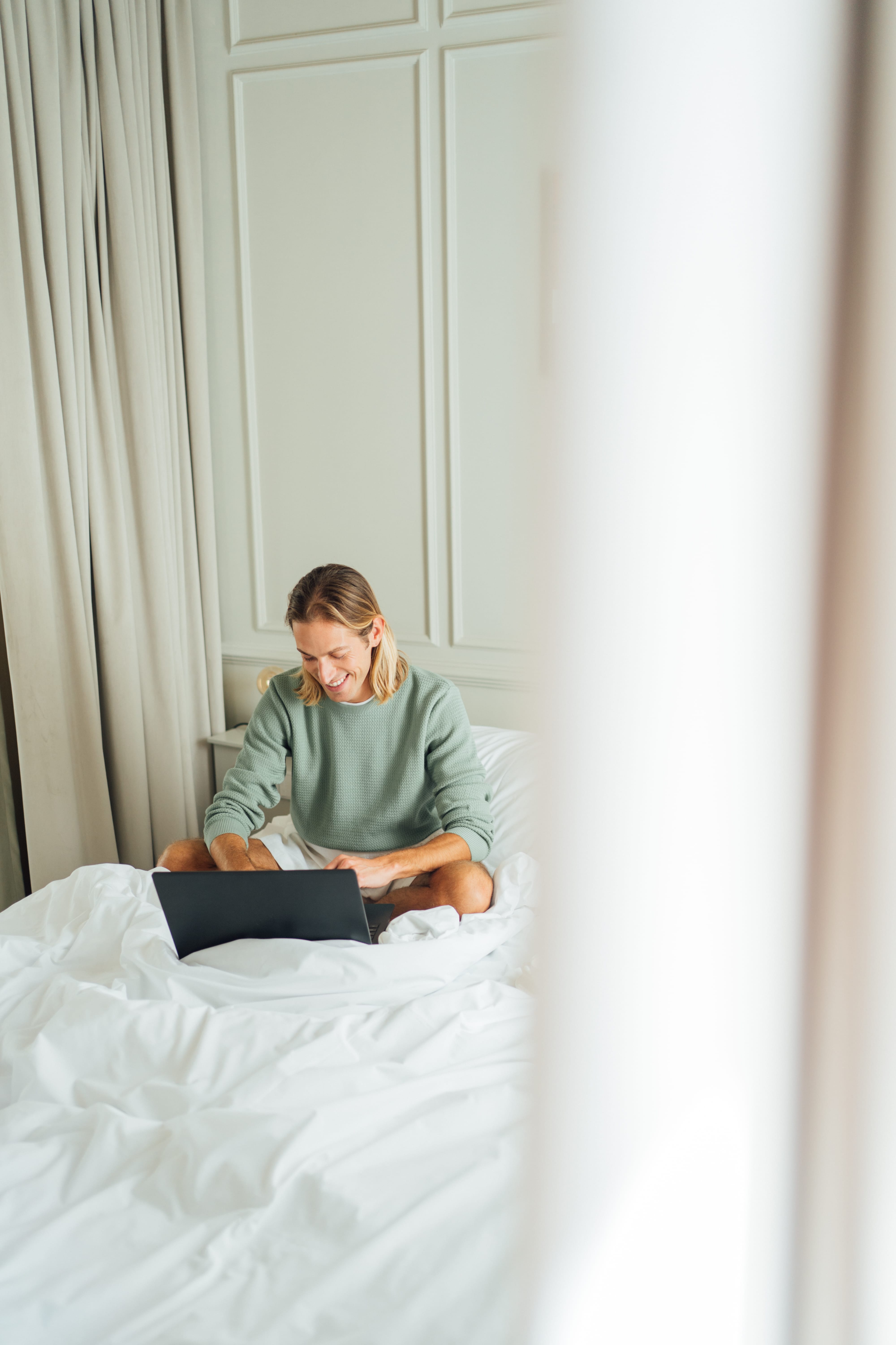 a person sitting on a bed