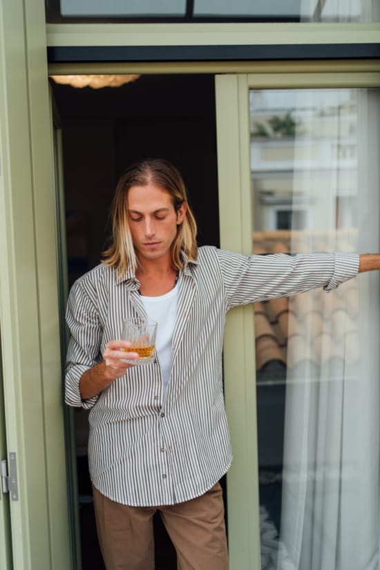 a person holding a drink