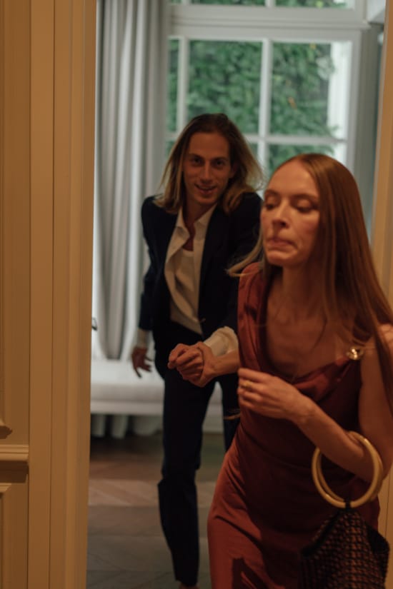 a woman standing next to a woman