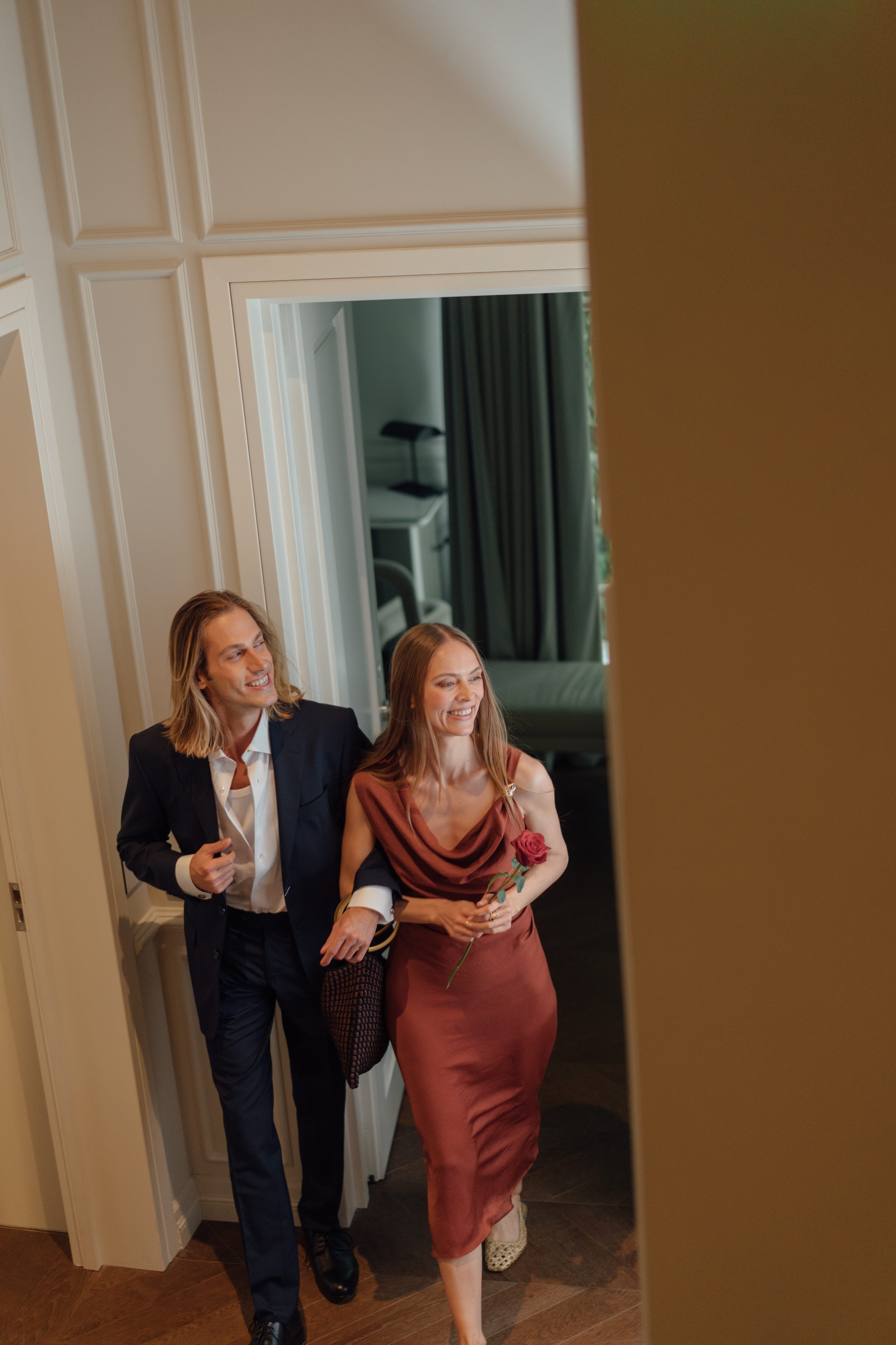 a person standing next to another woman