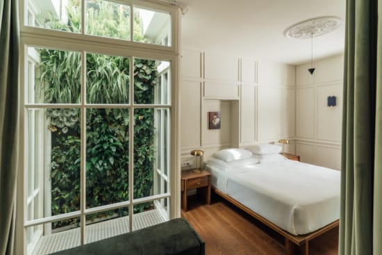 a bedroom with a large window