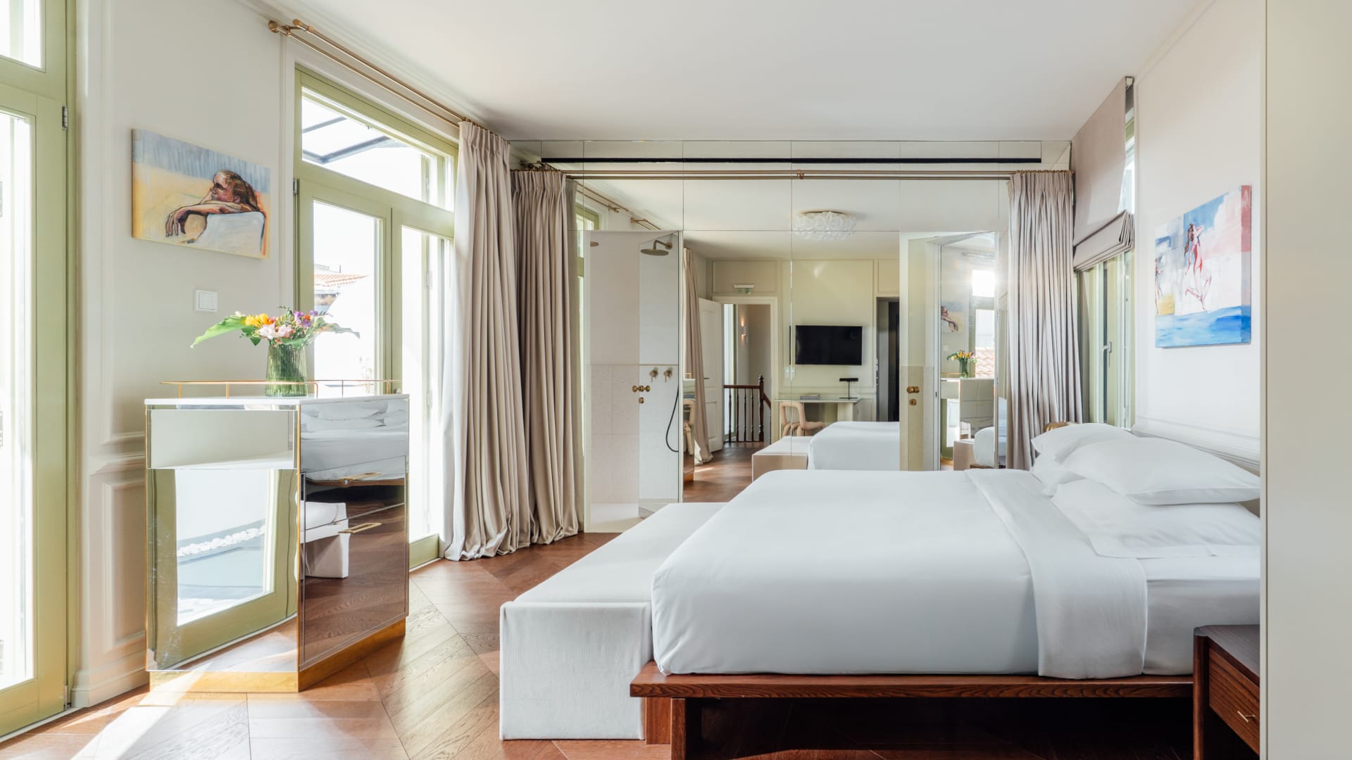 a bedroom with a large mirror