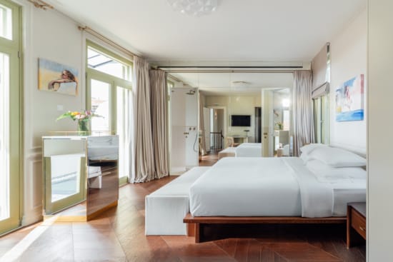 a bedroom with a large mirror