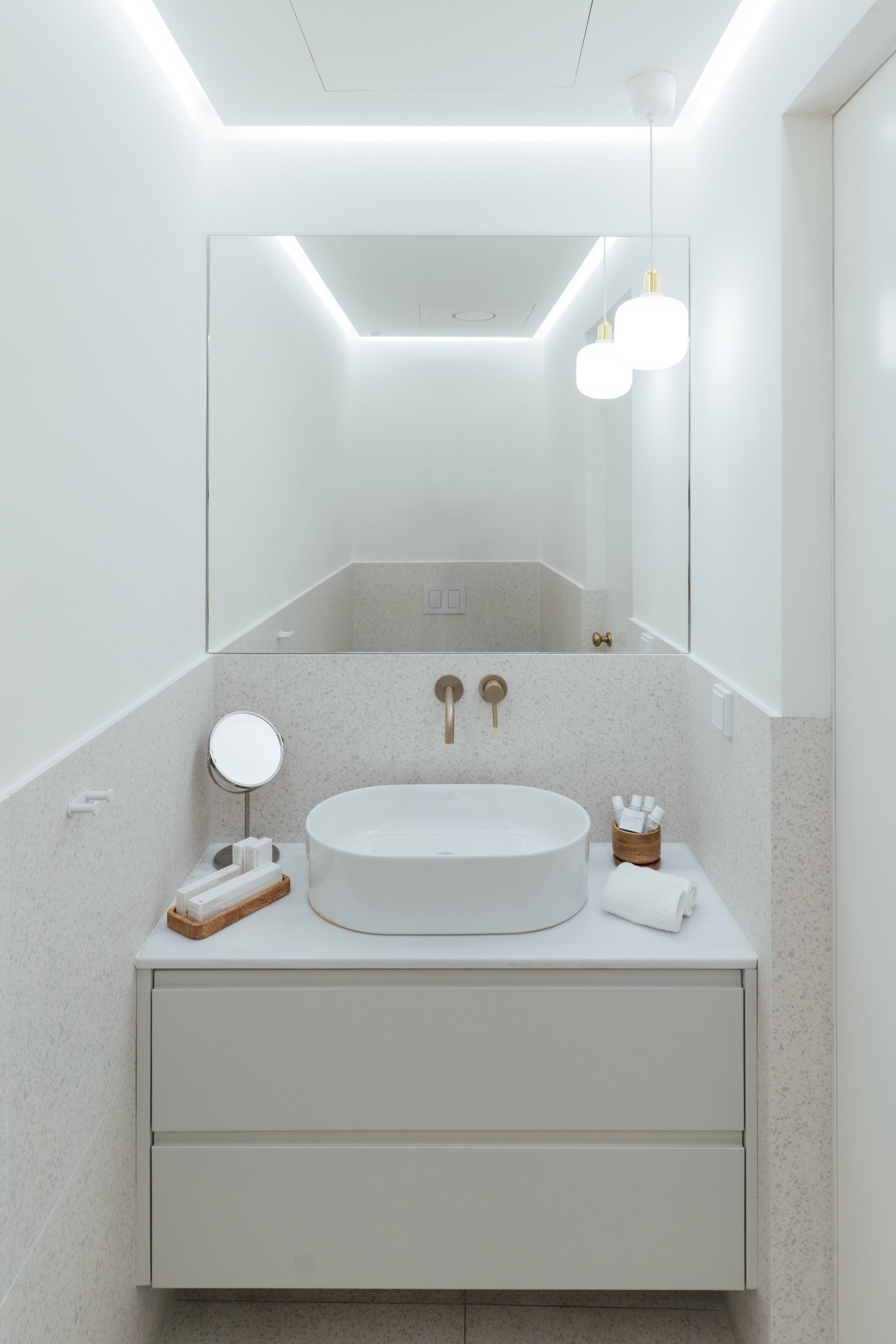 a bathroom with a sink and mirror