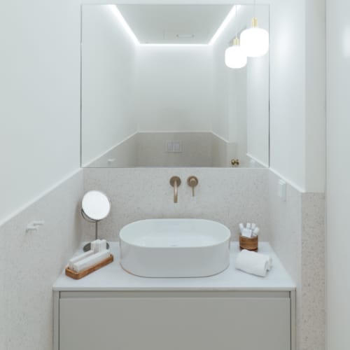a bathroom with a sink and mirror