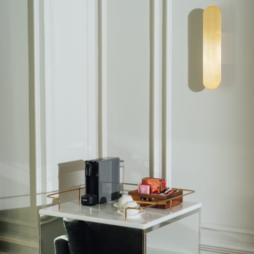 a desk with a chair and a light on it