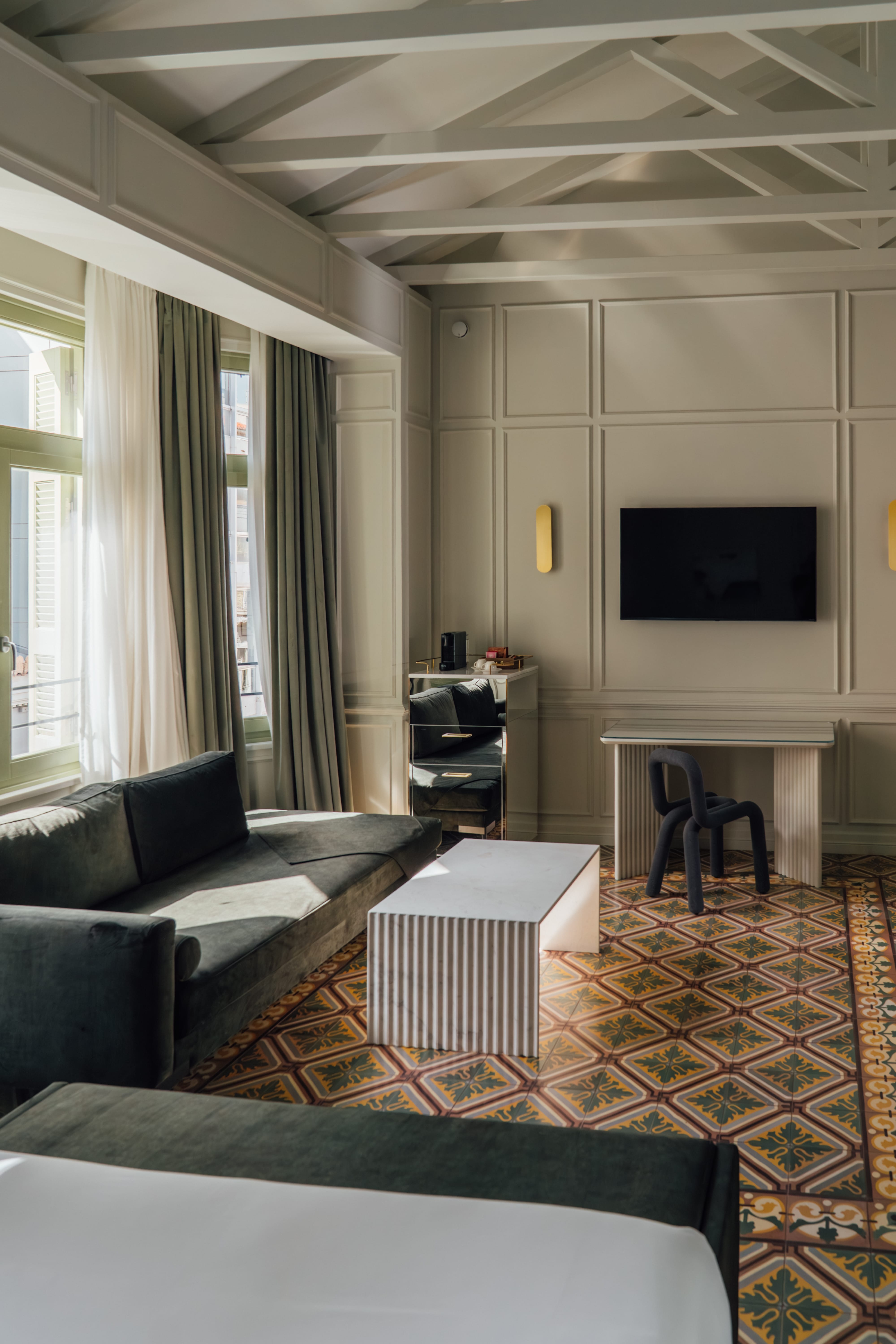 a living room with a tv and couches