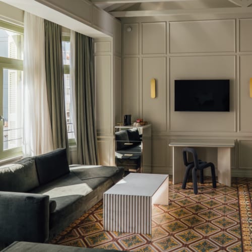 a living room with a tv and couches