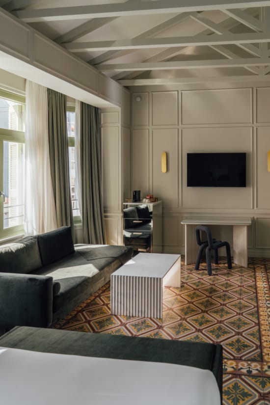 a living room with a tv and couches