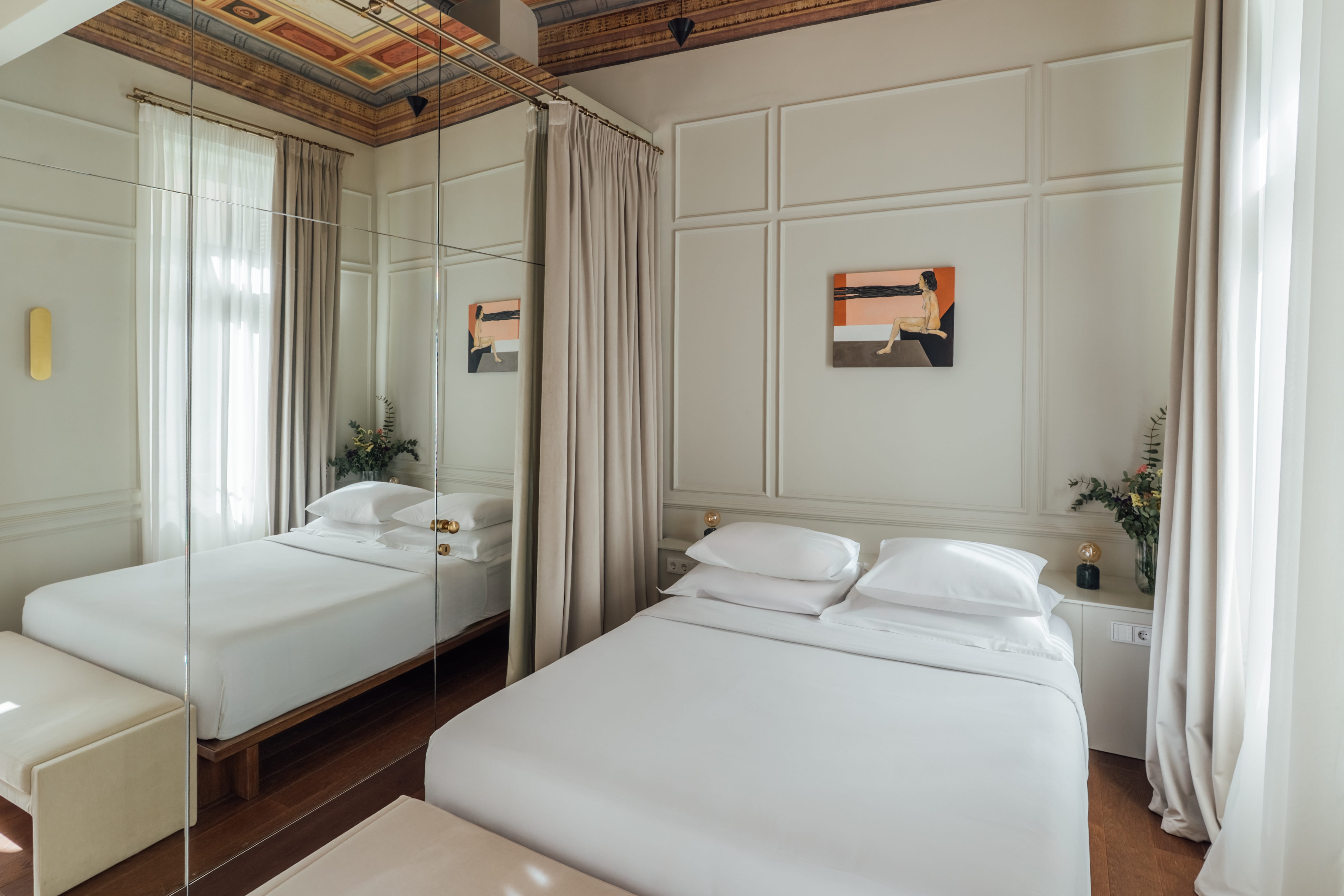 a bedroom with a large mirror