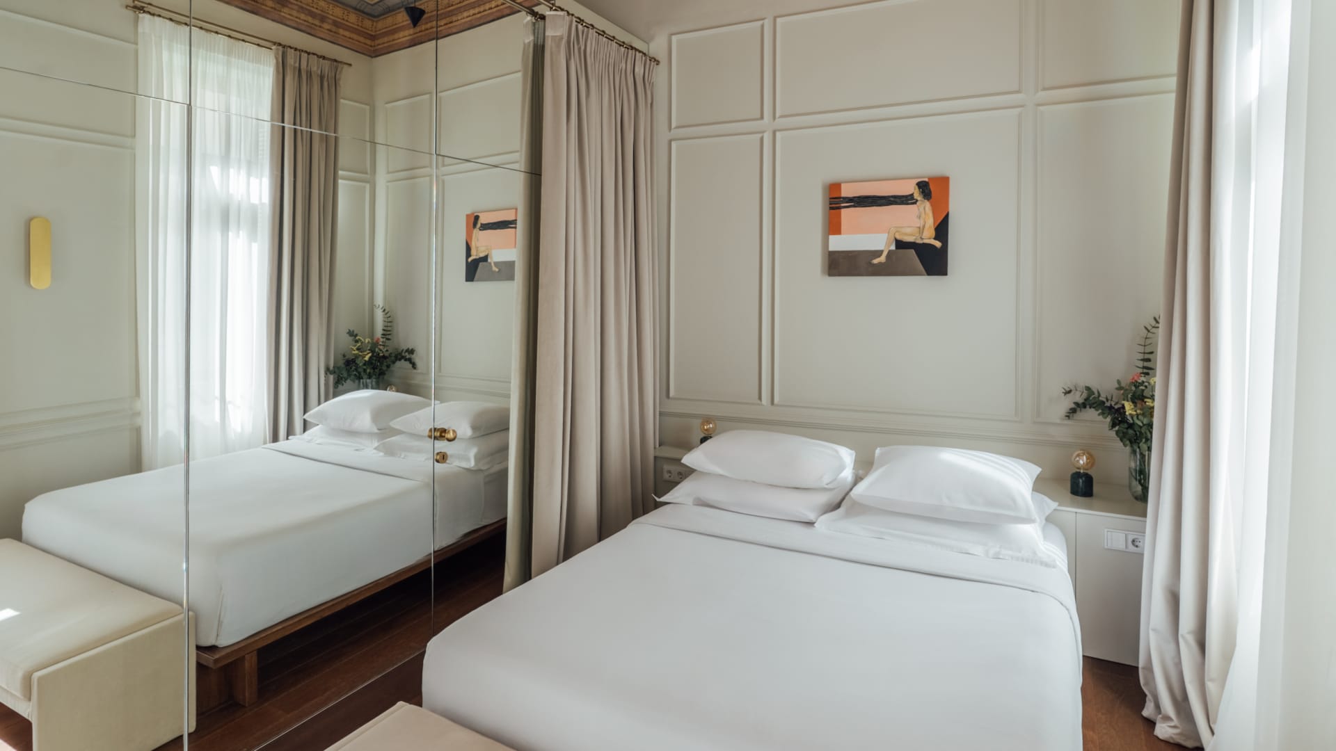 a bedroom with a large mirror