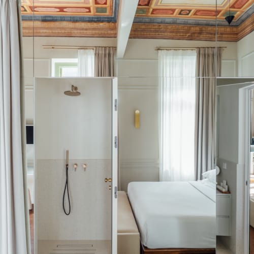 a bathroom with a shower unit and toilet