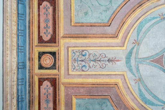 a wall with a painting on it