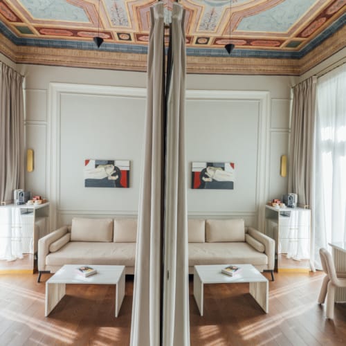 a room with a ceiling with a tree in it