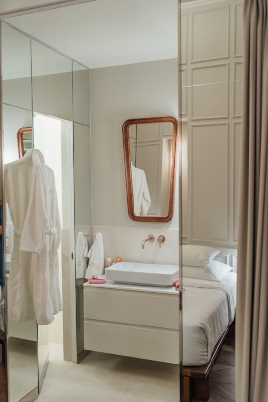a bathroom with a mirror and a sink