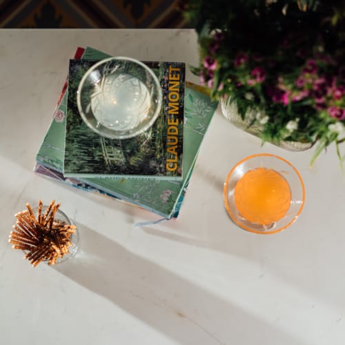 a vase with flowers and a box