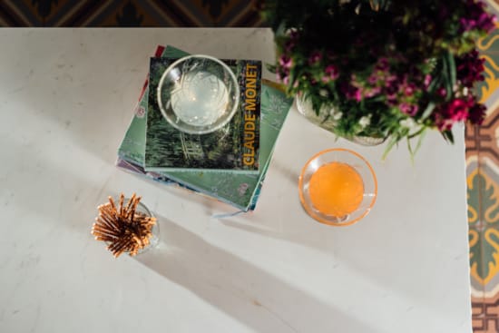 a vase with flowers and a box