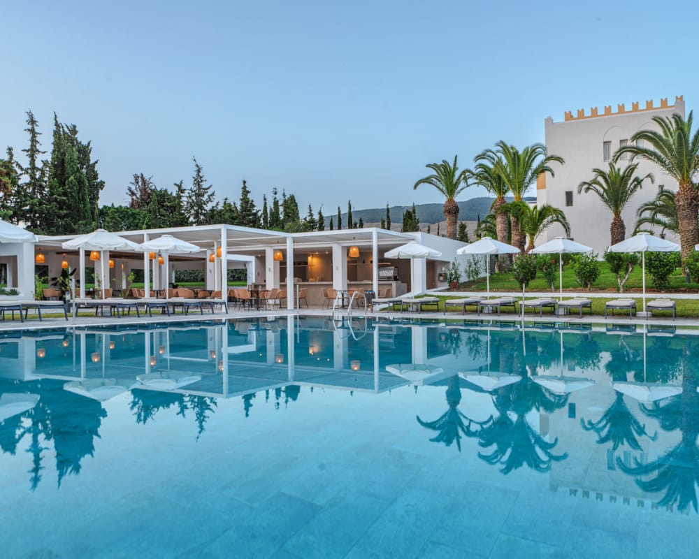 a pool with a building in the background