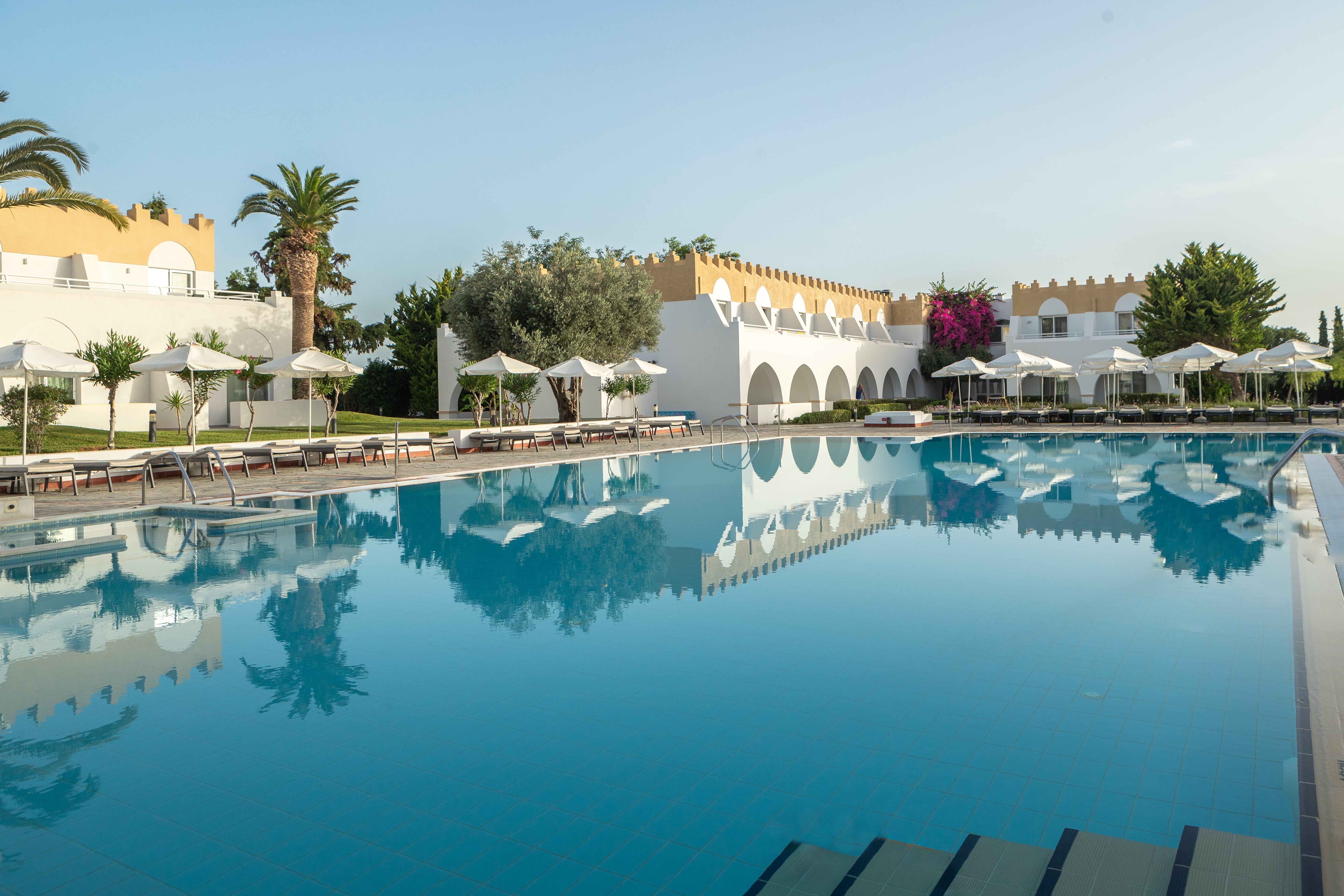 a pool with a building in the background
