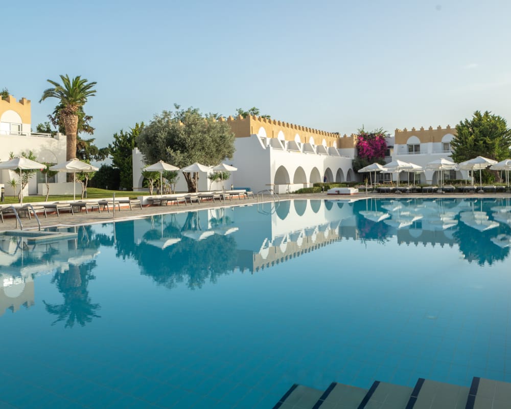 a pool with a building in the background