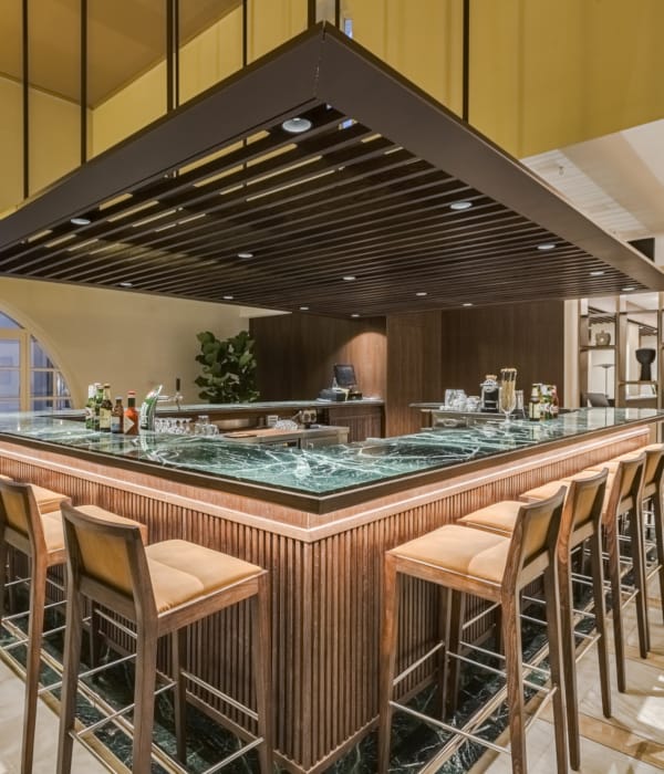 a bar with chairs and tables