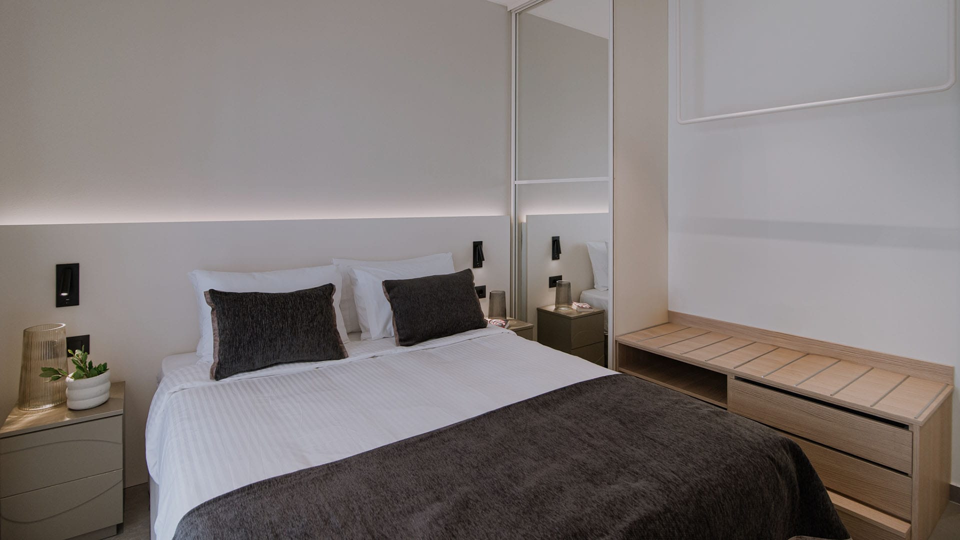 a bed with a white wall