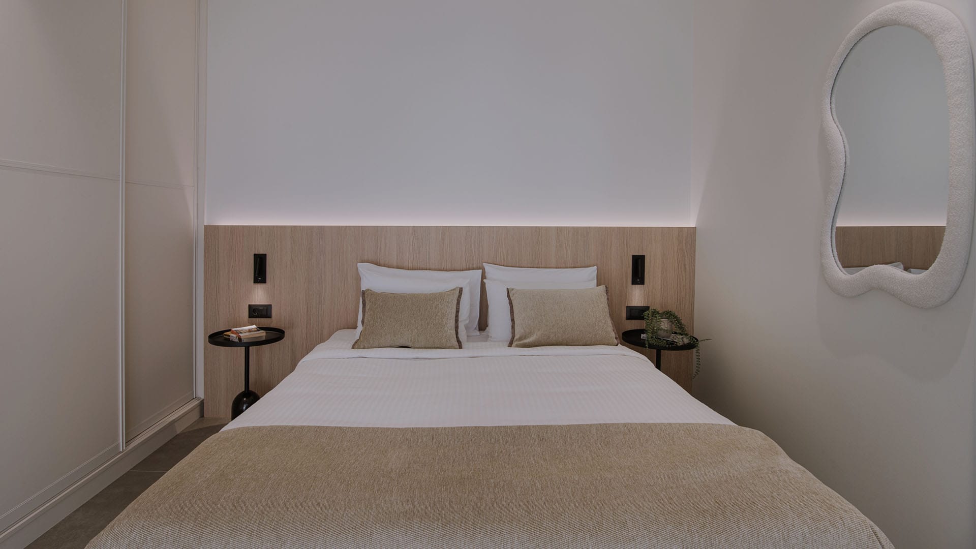 a bed with a white headboard