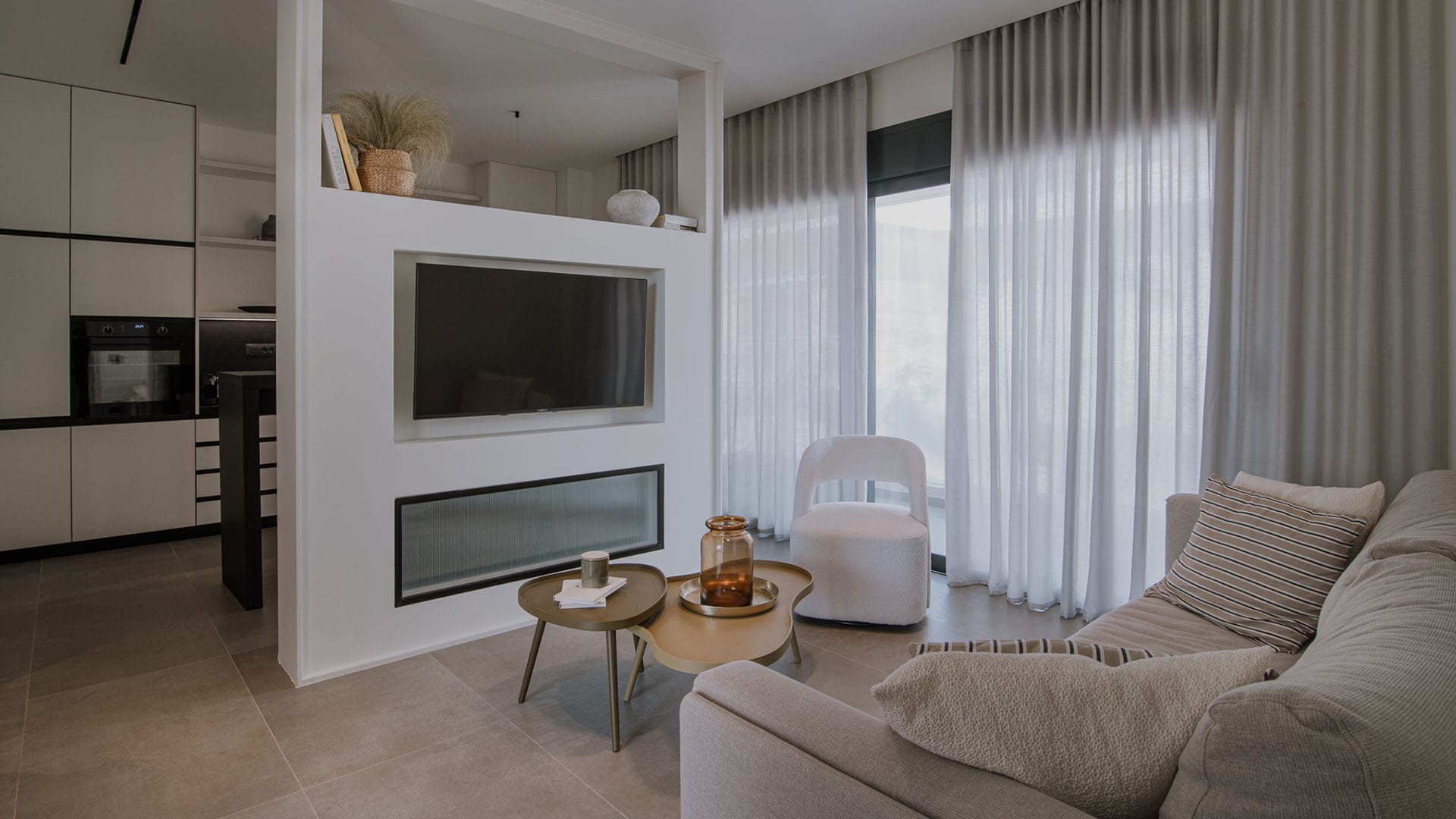 a living room with a tv and couches