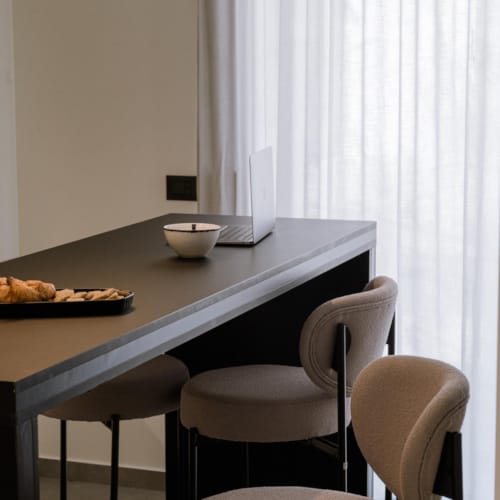 a table with chairs and a window