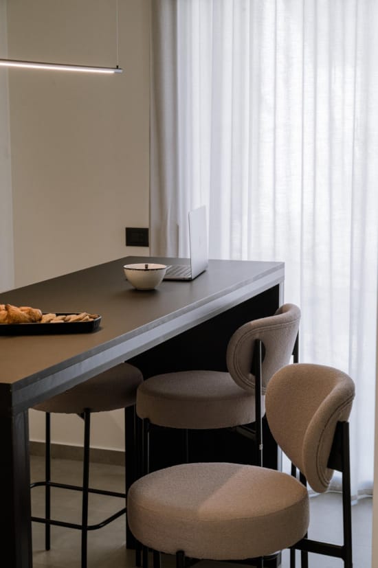 a table with chairs and a window