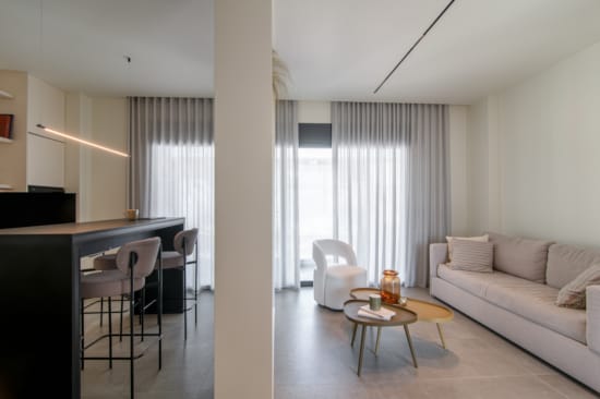 a living room with a couch and a table