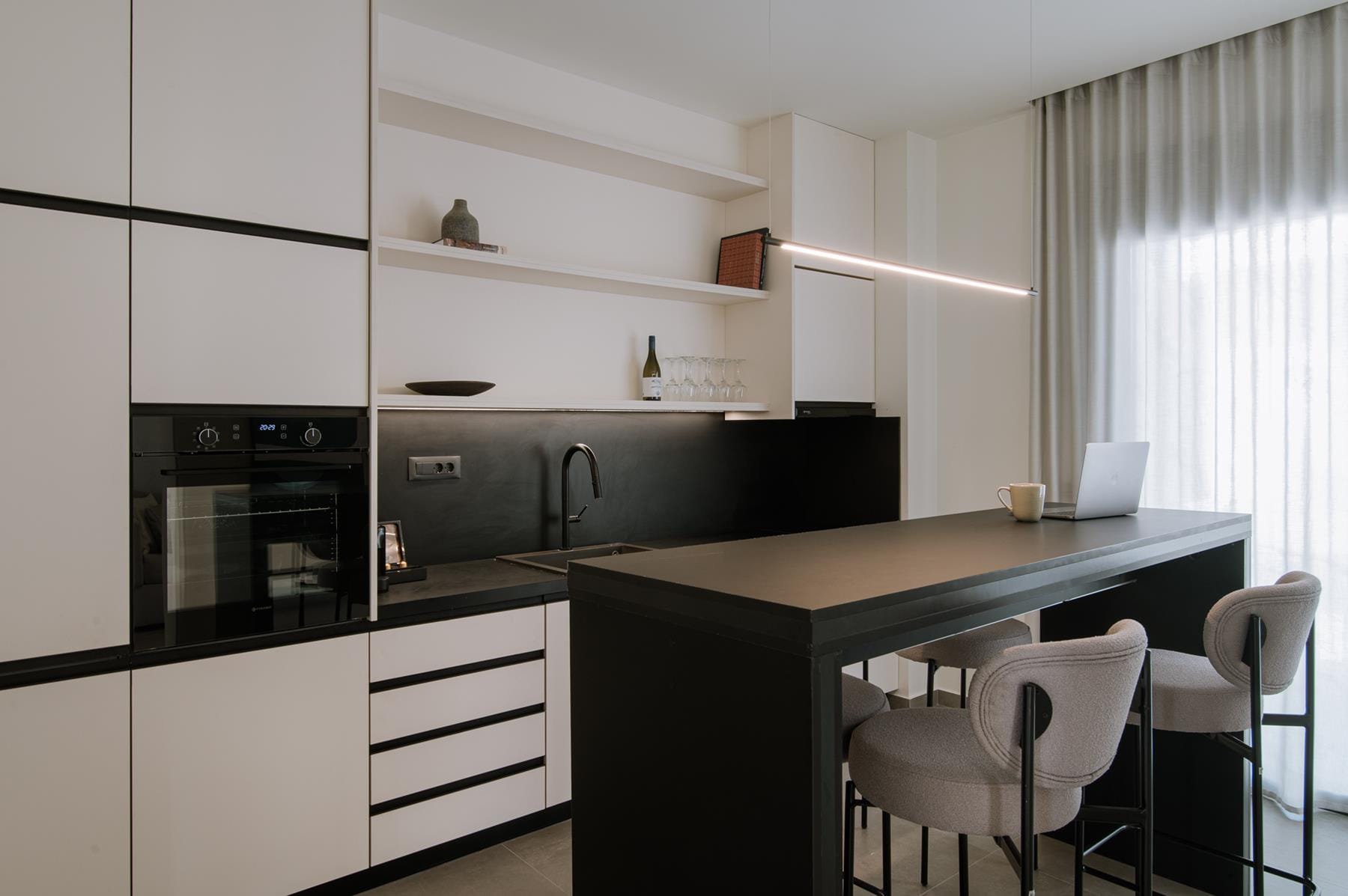 a kitchen with white cabinets