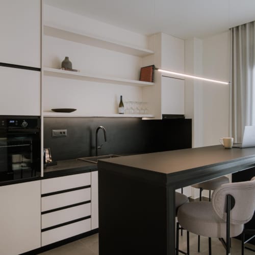a kitchen with white cabinets