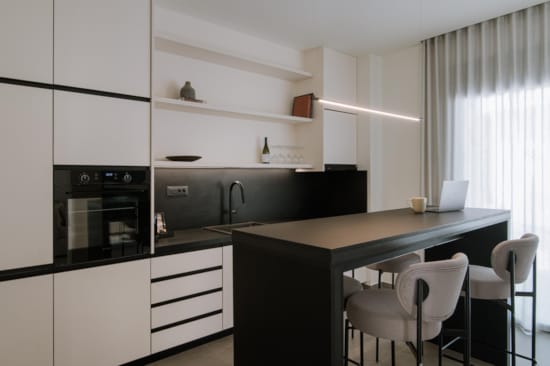 a kitchen with white cabinets