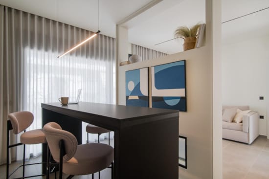 a room with a table and chairs